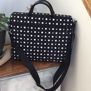 Black with white polka dots laptop carrying case or brief case.